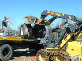 031 - Loading tires back on truck