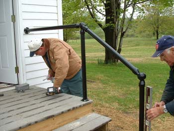 140 - The railings being mounted