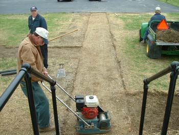 156 - The sidewalk area was compacted