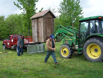 208 - Outhouse being unloaded