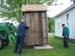 209 -Outhouse being positioned on slab